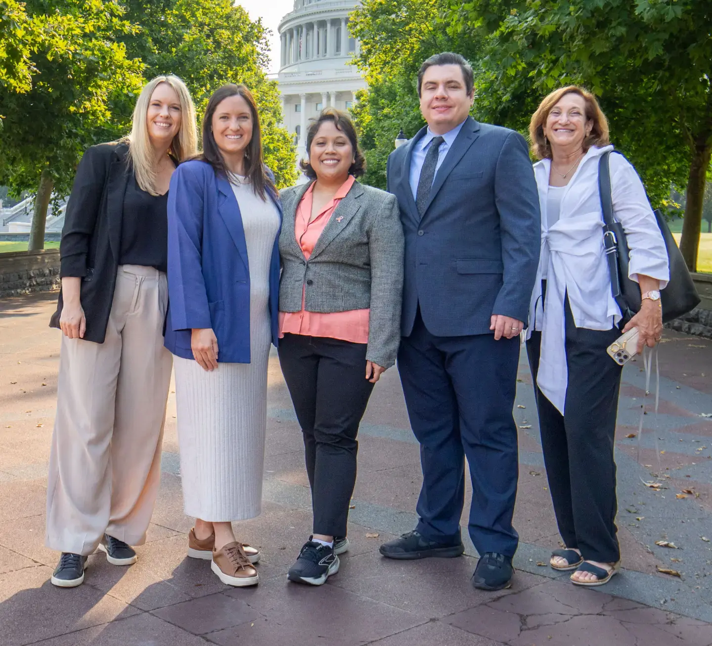 Five Patients Rising advocates standing together and smiling outside the U.S. Capitol in Washington, D.C.