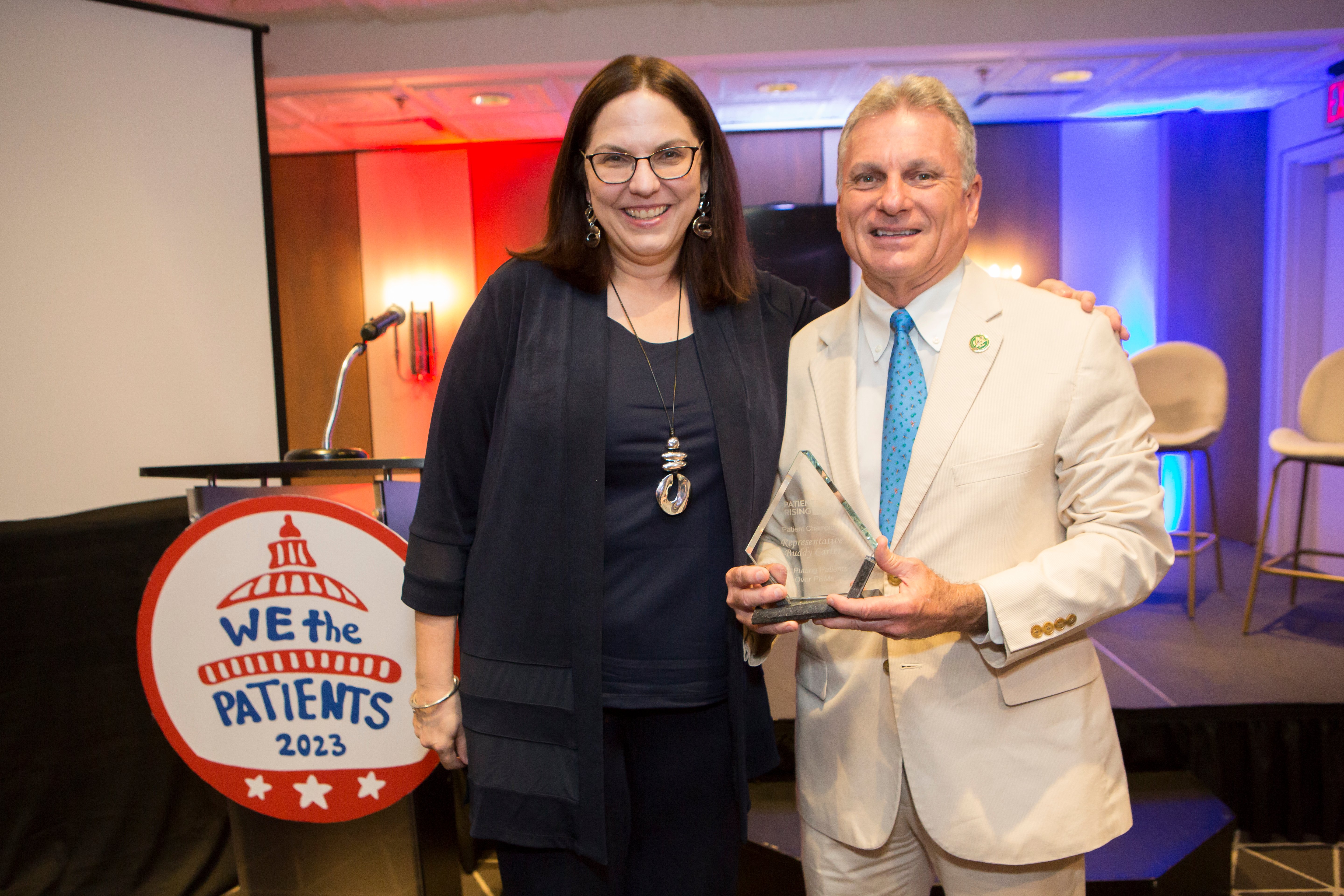 Terry Wilcox presenting Patient Champion award to Buddy Carter